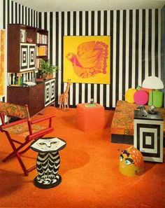 an orange carpeted room with black and white striped walls