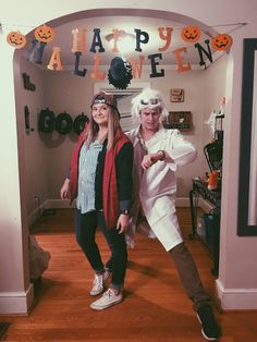 two people dressed up in costumes for halloween