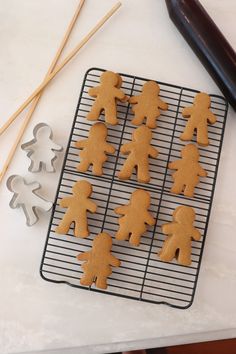 some cut out cookies are on a cooling rack