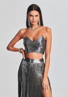 Our Sophia Top will quickly become the silver lining of your next night out. Zipped along the back, this strapless top wraps the bustier in lacquered pleats for a no slip sweetheart. Pair back to our Cressida Skirt for an award-winning look 95% Polyester 5% Spandex Made in China Model is 5'11" wearing size X-Small Outfit Fiesta, Party Frocks, Boned Bodice, White Sleeveless Top, Denim Sweater, Metallic Fabric, Silver Lining, Runway Collection, Toe Designs