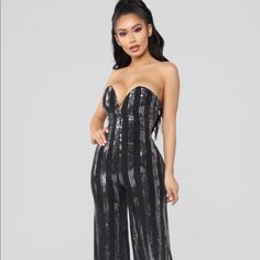 Gorgeous Black/Silver Sequin Jumpsuit. Strapless Neckline With Built In Support. Glamorous Strapless Jumpsuit For Date Night, Metallic Sequined Jumpsuits And Rompers For Night Out, Glamorous Strapless Jumpsuit For Party Season Date Night, Glamorous Strapless Jumpsuits And Rompers For Party, Glamorous Strapless Party Jumpsuits And Rompers, Glamorous Metallic Jumpsuits And Rompers For Night Out, Glamorous Black Strapless Jumpsuit For Night Out, Glamorous Black Strapless Jumpsuit For Parties, Glamorous Strapless Jumpsuits And Rompers For Date Night