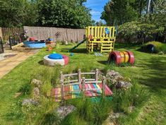 an outdoor play area with toys in the grass