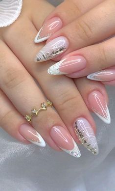 a woman's manicured nails with white and pink designs