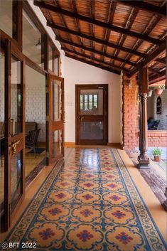 an ornately decorated hallway with wooden doors and brick walls, along with tiled flooring