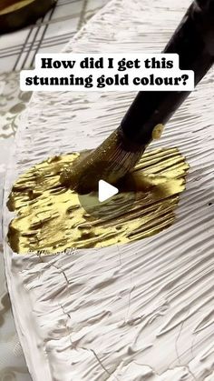 a person is painting with yellow paint on a white surface and the words how did i get this stumping gold color?