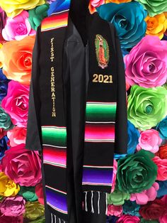 a black jacket with colorful flowers in the background