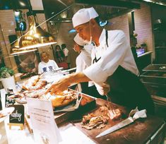 a chef is preparing food in a restaurant