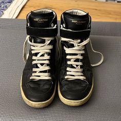 Authentic Saint Laurent Sl/12h Court Classic High Top Sneakers Euro Size: 42.5 / Us Size: 9.5 Shoes Were Purchased Around 2015, But Have Been Boxed Up For The Last Few Years. Photos Show Creasing And Other Gentle Wear. Soles In Moderate Condition But Are Probably Due To Be Re-Soled Soon. Laces Are Original. Price Reflects Condition. Luxury Leather High-top Sneakers With Laces, Ysl High Top Sneaker, Luxury Leather Lace-up High-top Sneakers, Luxury Leather High-top Sneakers With Stitched Sole, Yves Saint Laurent Sneakers Men, Black Leather Sneakers, Black High Tops, Saint Laurent Paris, Saint Laurent Shoes