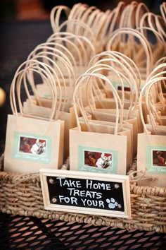 there are many small brown bags on the table with name tags in front of them