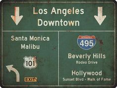 a green street sign showing the route to los angeles down town and santa monica, beverly hills