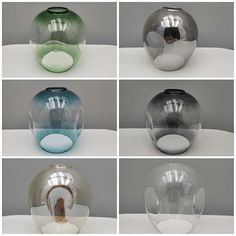 six different colored vases sitting on top of a white table next to each other