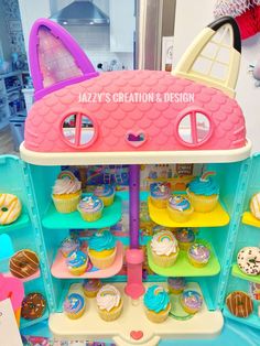 an assortment of cupcakes and cakes on display