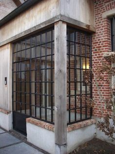 a brick building with bars on the windows