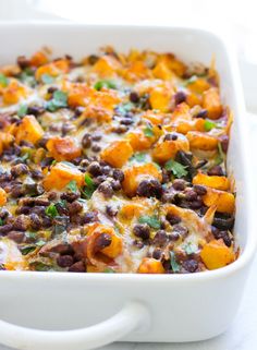 a casserole dish filled with black beans and cheese