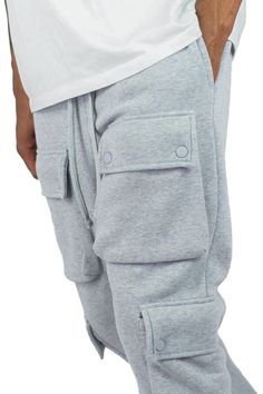 Functional cargo pockets Flared at leg opening Fleece sweatpants Elastic waistband with drawstring 100% Polyester Urban Cotton Joggers With Multiple Pockets, Urban Cotton Joggers With Pockets, Urban Cotton Multi-pocket Joggers, Solid Color Sports Sweats With Pockets, Utility Sweatpants With Drawstring For Loungewear, Utility Style Drawstring Sweatpants For Loungewear, Utility Drawstring Sweatpants For Loungewear, Utility Sweatpants With Pockets For Streetwear, Sporty Winter Cargo Pants With Multiple Pockets