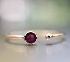 "Open Cuff Ring, 14k Gold Ruby Ring, Delicate Gold Ring, Dual Ring, Open Gold Ring, Gold Ball Ring, Adjustable Gold Ring, Textured Band Ring, Minimalist Ring. Delicate, minimal, trendy ruby ring . It was made of 1mm delicate 14k gold textured band and 3mm rose cut genuine ruby stone setting on 14k gold bezel setting. there is a tiny ball other side. It's open and just a little ( maybe half size) adjustable. Rubies, the birthstone of July, are considered the king of gems and represent love, healt Minimalist Stackable Adjustable Ruby Ring, Minimalist Adjustable Ruby Promise Ring, Minimalist 14k Gold Open Ruby Ring, Adjustable Minimalist Ruby Ring For Anniversary, Adjustable Gold Ring, 14k Gold Ruby Ring, Open Cuff Ring, Delicate Gold Ring, July Birthstone Ring