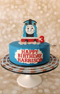 a thomas the train birthday cake on a table