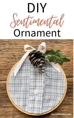 a pine cone sitting on top of a wooden table with the words diy sentimental gift idea