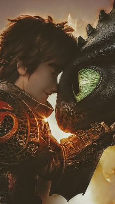 a young boy is kissing a dragon in the movie how to train your dragon