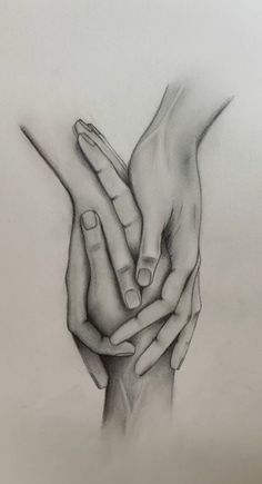 two hands holding each other with their fingers touching one another's hand, in black and white