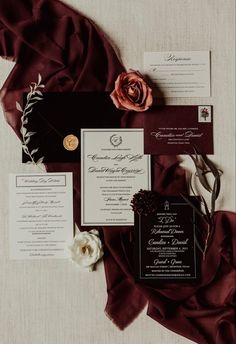 the wedding stationery was done in burgundy and black