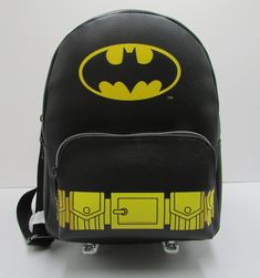 FUNKO BATMAN MINI BACKPACK                New with Tags             Target Exclusive Bag        Genuine Funko Licensed Bag                      HIGHLIGHTS: *  Black faux leather features Batman *  Front easy access flush zipper compartment  *  Dual zippers - zip around closure *  Top grab handle & adjustable backpack straps *  Fully lined in Black  MEASURES: 11"(h) x 5"(d) x 8.5"(L) SMOKE FREE HOME I ship within 24 hours of cleared payment via USPS PRIORITY MAIL which includes delivery confirmat Yellow Leather School Backpack, Yellow Leather Backpack For School, Logo Bags For Everyday Use And Back To School, Back To School Logo Bags, School Backpack With Logo, Logo Backpack For Everyday Use And Back To School, Back To School Backpack With Logo For Everyday Use, Backpack Straps, Mini Backpack