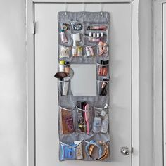 an over the door makeup organizer hanging on a door