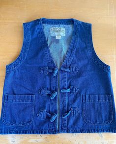 The cutest vintage denim vest with two front square pockets and three large toggle closures  100% cotton  Tag reads size small fits small and medium By Solanza Vintage Denim Vest, Vest Outfits, 90s Vintage, Denim Vest, Vintage Denim, Womens Vest, The Cutest, Square, Clothes For Women