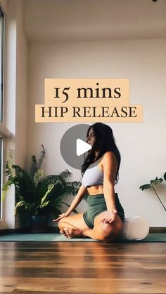 a woman sitting on top of a yoga mat with the words 15 mins hip release