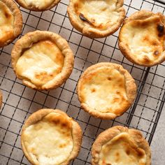 nine small pies sitting on a cooling rack