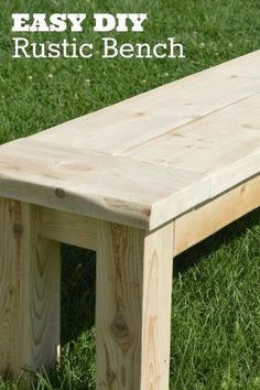 a wooden bench sitting in the grass with text overlay that reads easy diy rustic bench