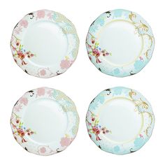 four plates with floral designs on them