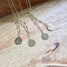 Zodiac Sign Necklace ~ Beautiful gold hand stamped circle disc charm necklace on 14K gold fill satellite chain adds a glint of gold, great for layering. Choose your zodiac sign and length from the drop down menu. Zodiac signs~ AQUARIUS- 1/21 - 2/19 PISCES- 2/20 - 3/20 ARIES- 3/21 - 4/20 TAURUS- 4/21 - 5/21 GEMINI- 5/22 - 6/21 CANCER- 6/22 - 7/22 LEO- 7/23 - 8/21 VIRGO- 8/22 - 9/23 LIBRA- 9/24 - 10/23 SCORPIO- 10/24 - 11/22 SAGITTARIUS- 11/23 - 12/22 CAPRICORN- 12/23 - 1/20 **Necklace is handmade Surfer Girl Gifts, Crystal Point Necklace, Zodiac Sign Necklace, Gold Chain Choker, Sign Necklace, Stamped Rings, Leo Scorpio, Zodiac Signs Aquarius, Gold Hand