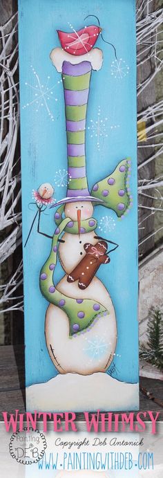 a painting of a snowman holding a candy bar in front of a blue background