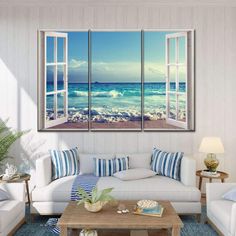 a living room filled with furniture and an open window overlooking the ocean on a sunny day