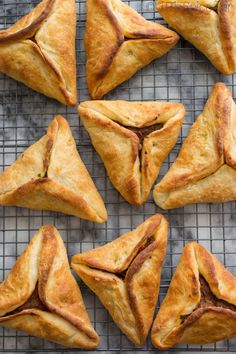 several pastries on a cooling rack with one cut in half and the other folded up