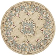 a round rug with flowers and leaves on the center, in blue and beige colors