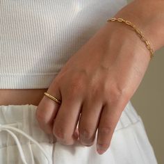 Our Paperclip bracelet is a golden staple to wear alone or stack with our other gold filled bracelets. Our 14k gold-filled jewelry is bonded with 14k gold and is water and tarnish resistant. 14k gold-filled jewelry is a great alternative to solid gold, and can be worn by people with sensitive skin. The color will not tarnish but recommend to keep away from perfumes and lotions. - 14k gold-filled- Chain width: 3.5 mm.- Chain length: 6"- Water resistant / Tarnish resistant / Hypoallergenic Minimalist Tarnish Resistant Recycled Gold Bracelet, Adjustable Minimalist Bracelets In Recycled Gold, Minimalist Adjustable Bracelets In Recycled Gold, Minimalist Adjustable Recycled Gold Bracelets, Minimalist Yellow Gold Plated Bracelet, Minimalist Gold Plated Jewelry With Rectangular Links, Minimalist Gold-plated Jewelry With Rectangular Links, 14k Gold Filled Jubilee Bracelet Jewelry, Minimalist 14k Gold Filled Jubilee Bracelet