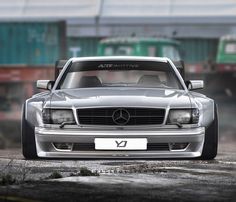 the front end of a silver mercedes benz coupe