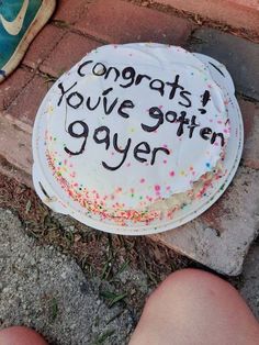 a birthday cake that says congrats you've gotten gayer