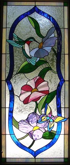 a stained glass window with flowers on it