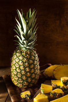 a pineapple cut in half and sliced into wedges