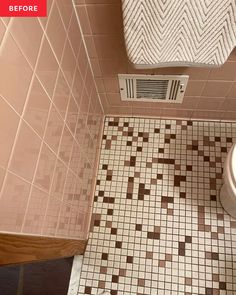 a bathroom with a toilet and tiled floor