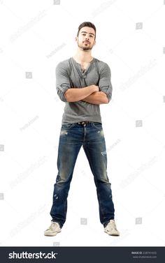 a man standing with his arms crossed and looking at the camera, on a white background