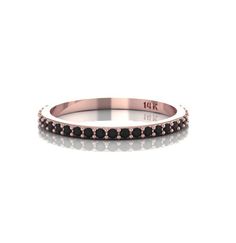 a rose gold ring with black diamonds