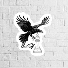 a sticker with an eagle flying over a chess piece