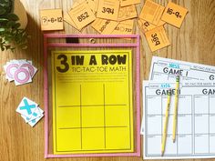 three in a row tic - tac - toe math game on a table