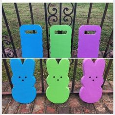 four different colored plastic bunny bags sitting in front of a gate with the same design on them