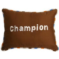 a brown pillow with the word champion printed on it