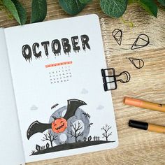 an open notebook with the word october written on it